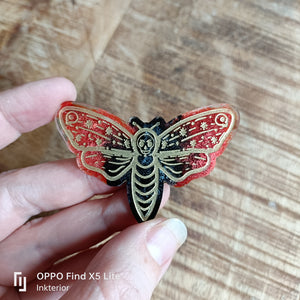 Red black moth magnet