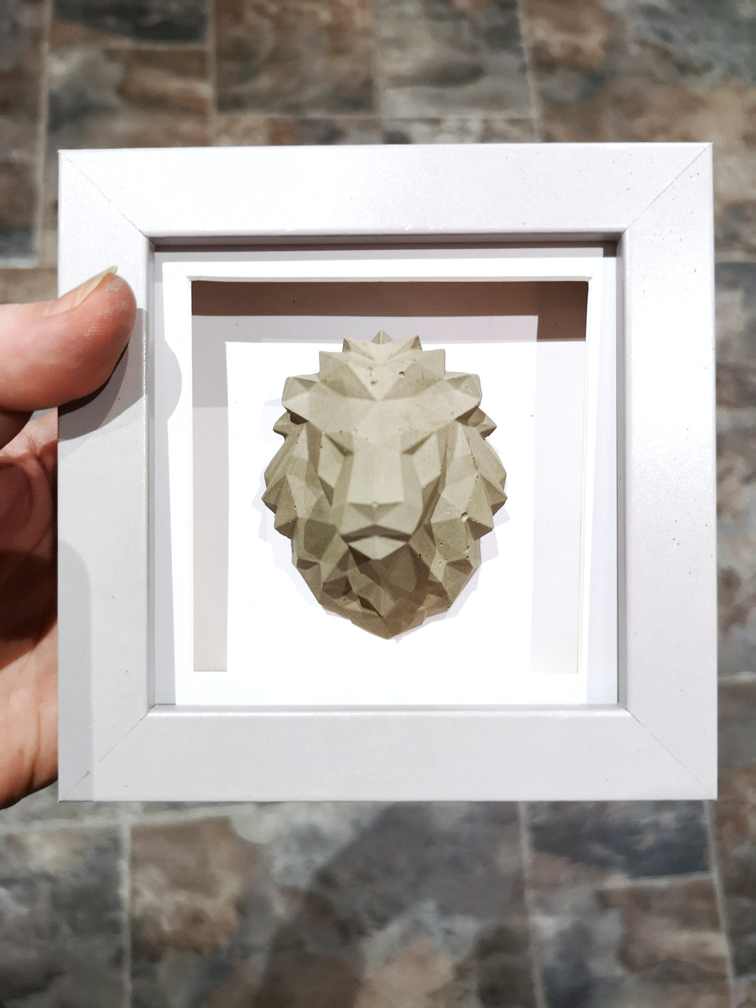 Geometric concrete lion frame