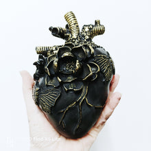 Black gold anatomical heart sculpture 